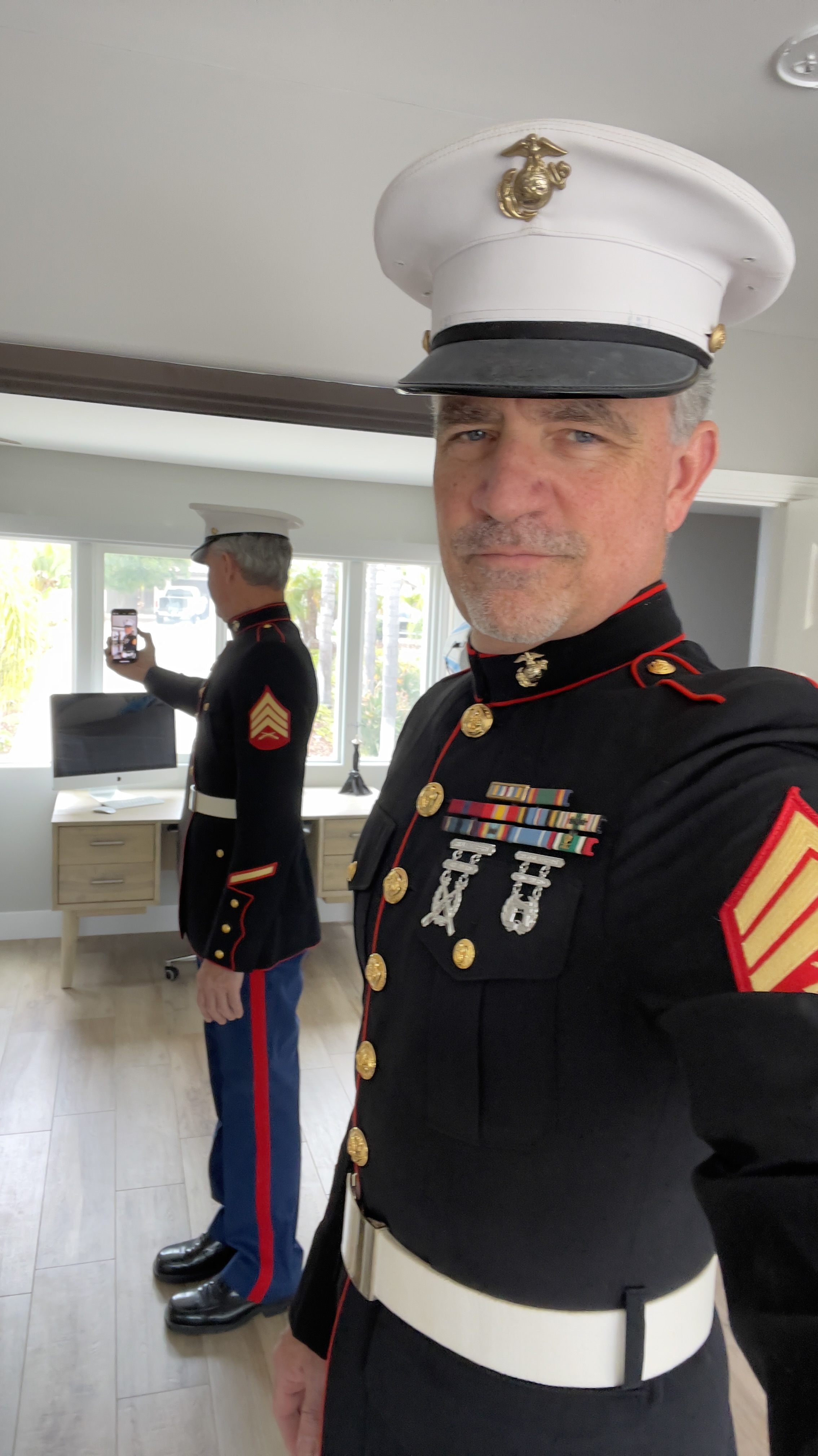 Sergeant Ely in dress blues — still fits, still fighting